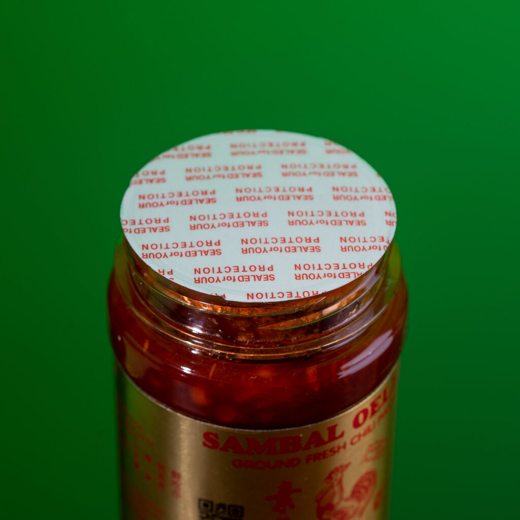 Jar of sambal with tamper proof seal in place.